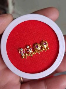 Gold  Jhumka Earrings with Red Stones