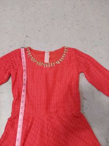 Elegant Coral Lace Gown with Embellished Neckline
