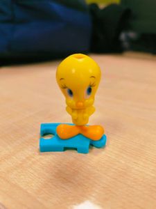 Cute Tweety Bird Toy Figure holding pink bag pack,