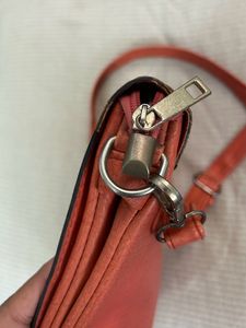 beautiful orange sling bag
