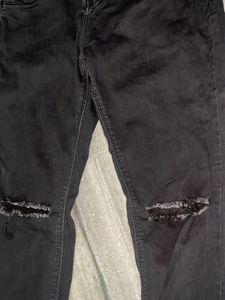 black distressed jeans