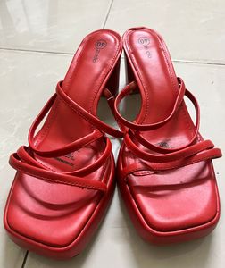 Unused red heels