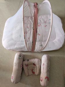 Baby nest with pillows and mosquito net
