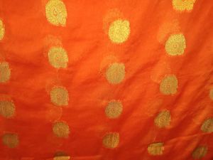 Vibrant Orange Saree with Gold Dots