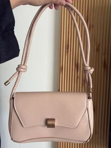 chic nude color side bag with golden buckle