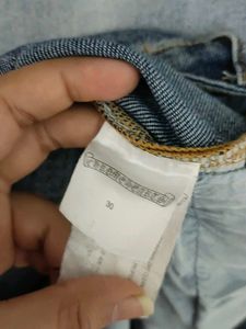 Chrome Hearts cross patch graphic blue jeans