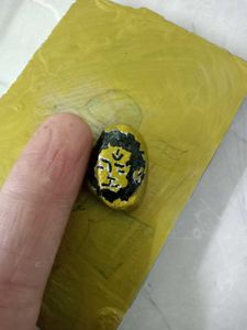 Hand-Painted Lion Face Stone Art