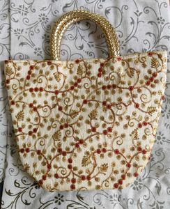 Stunning cream golden coloured handbag