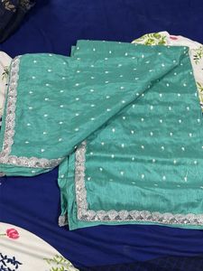 Elegant Teal Saree with Silver Border