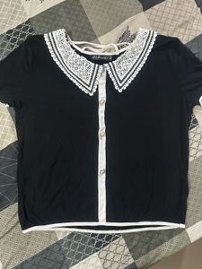 Chic Black Top with Lace Collar and orange to