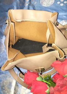 Stylish Beige Handbag with Tassel Accent