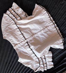 Chic White Ruffle Top with Black Trim