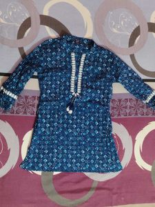 Blue printed short kurti with white lace