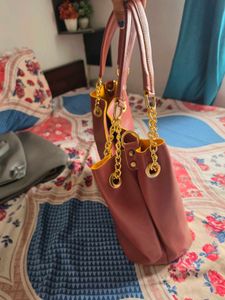 Chic Maroon Handbag with Gold Chain Accents