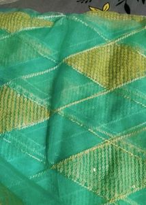 Elegant Teal Saree with white Diamond type Pattern