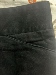 Chic Black Skirt with Embroidered Hem