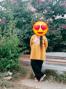 Yellow printed crop top and korian paint combo