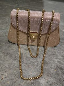 purse in rose Golden colour.
