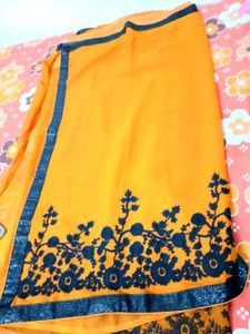 Vibrant Orange Saree with Floral Border