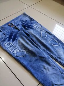Distressed Blue Denim Jeans