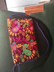 Embroidered Sling Bag.
