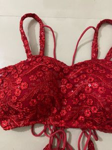 red backless blouse