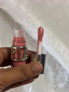 Assorted Lip Glosses and Makeup Bag