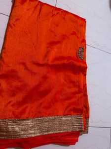 Vibrant Orange Saree with Embellishments