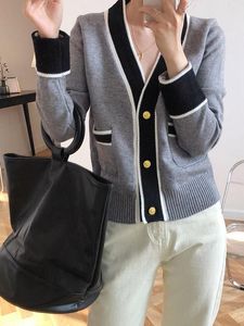 Chic grey cardigan with contrast trim 🤍