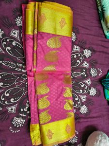 Vibrant Pink Saree with Golden Motifs
