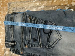 Distressed Blue Denim Jeans