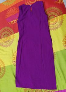 Dark Purple Shiny A Line Kurti Of Size-xs/'s' available...Length Is Just Below The Knee.....Apair Of Sleeves With An Extra Button Available Inside It