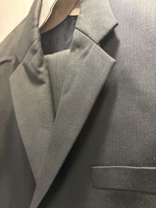 A Raymond Suit of rich dark greenish black colour