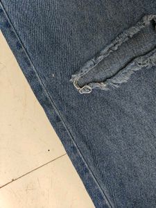 Distressed Blue Denim Jeans