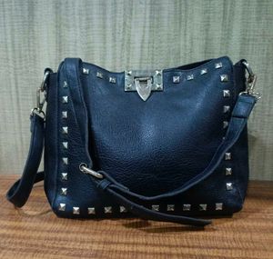 Black studded shoulder bag