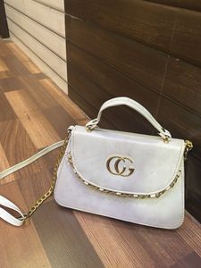 Chic White Handbag with Gold Chain Detail