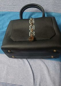 Stylish Black Handbag with Gold Chain Detail