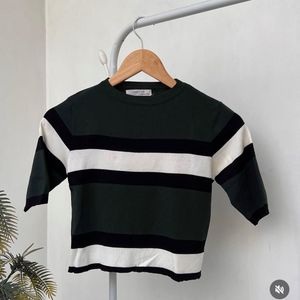 Green and White printed top.