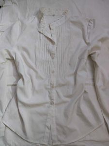 white pleated shirt