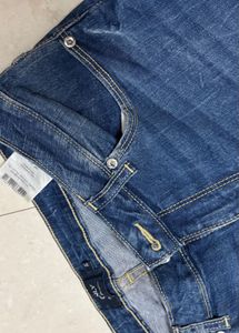 Distressed Blue Denim Jeans with Zipper Cuffs