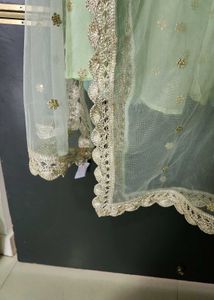 Mint Green Lehenga Choli with Gold Embellishments