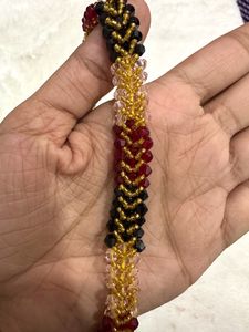 Multicoloured beaded neckpiece &amp; clutches