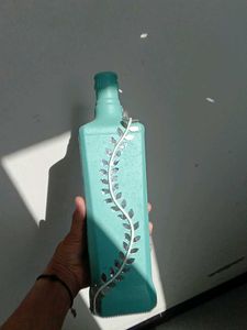 Decorative Teal Bottle with Vine Accent