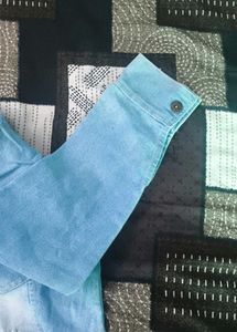 Light Wash Denim Jacket with Distressed Details