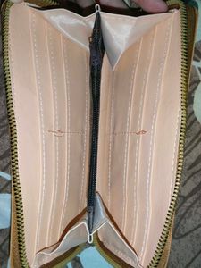 Stylish Tan Wallet with Pom-Pom Charm