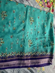 Teal Saree with Floral Motifs