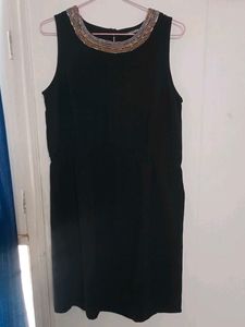 Elegant Black Dress with Embellished Neckline