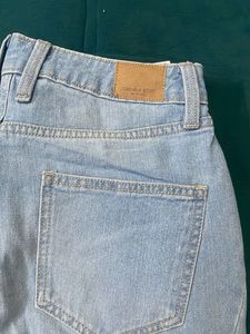 Light Wash Flared Jeans with Side Slits