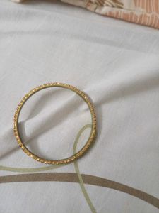 Elegant Gold Bangle with Black Stones