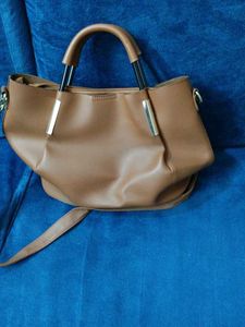 Brown Bag With Cutwork Design In Front